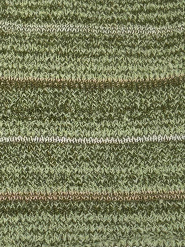 Close-up of a knitted fabric with horizontal stripes in olive green, sage green, and thin brown and white stripes.